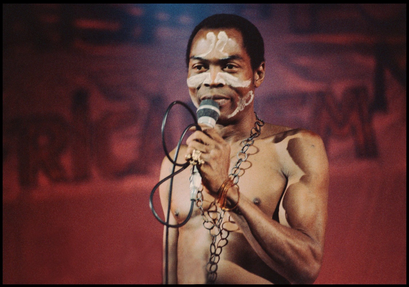 Fela Anikulapo-Kuti performing on stage with his saxophone